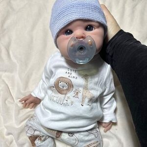 Adorable Baby Doll with Blue Hat